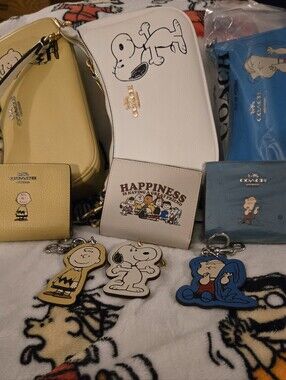 Coach Snoopy Collection Mini Bags & Wallets in White, Yellow, Blue, Cream